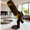 A Hand-Shaped Wine Bottle Holder